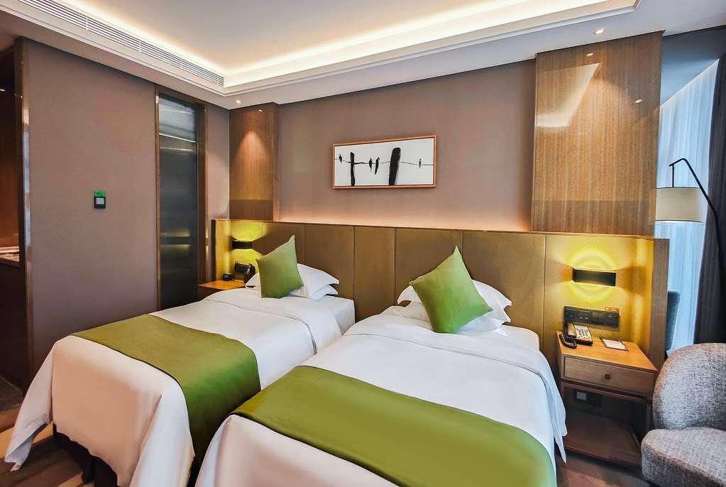 Leshan Ramada Hotel Quarto foto