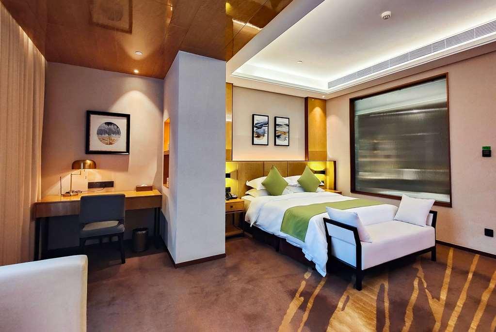 Leshan Ramada Hotel Quarto foto