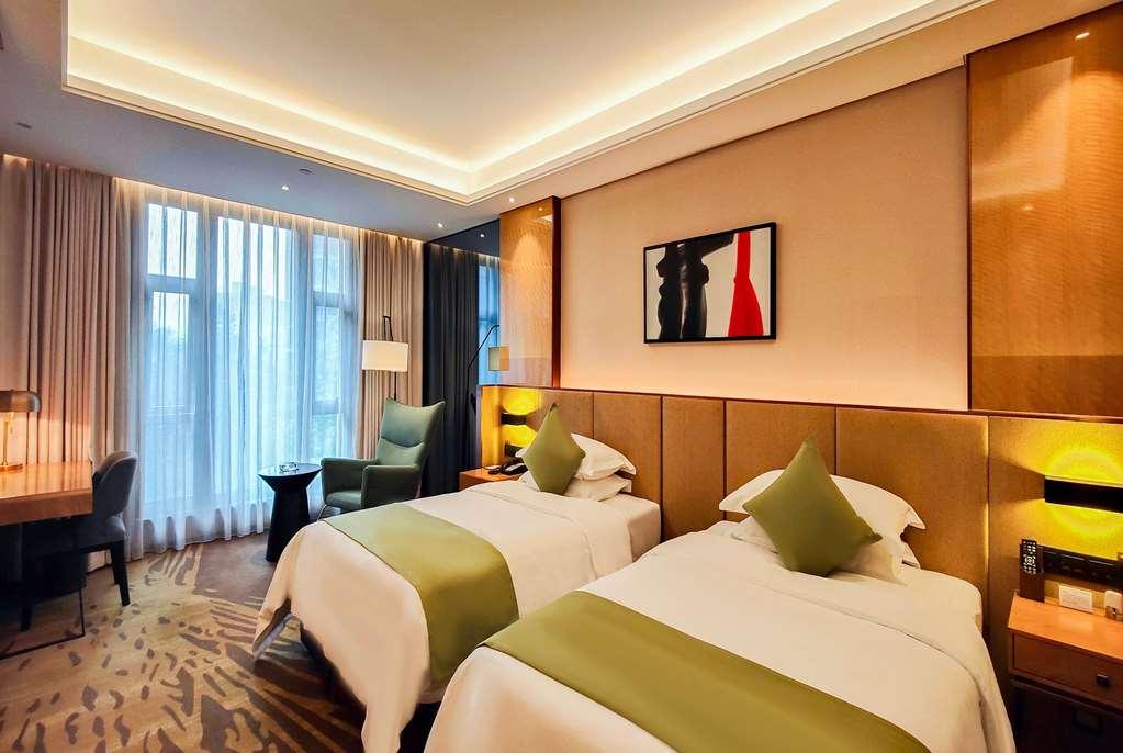 Leshan Ramada Hotel Quarto foto